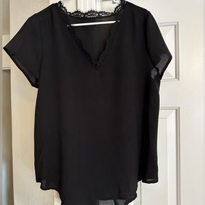 Women’s black L top.
